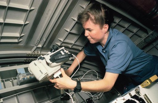 Astronaut Janice Voss with video camera in Spacehab-3