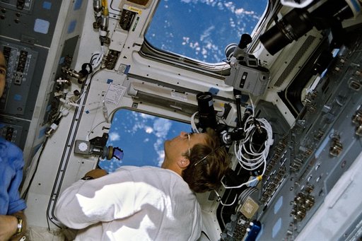 Astronaut Mark Lee monitors LITE at work in cargo bay