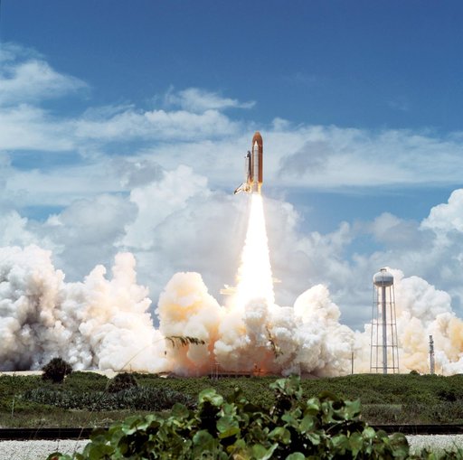 STS-65 Columbia, OV-102, clears launch tower after liftoff from KSC LC 39A
