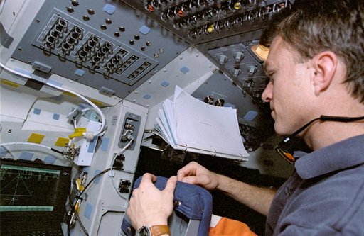 Astronaut Brent Jett monitors display during rendezvous operations