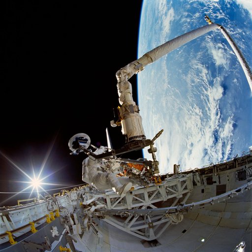 Payload bay activity during first EVA of STS-72 mission