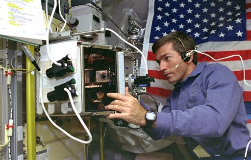 OTFE, Payload Specialist Fred Leslie works in Spacelab