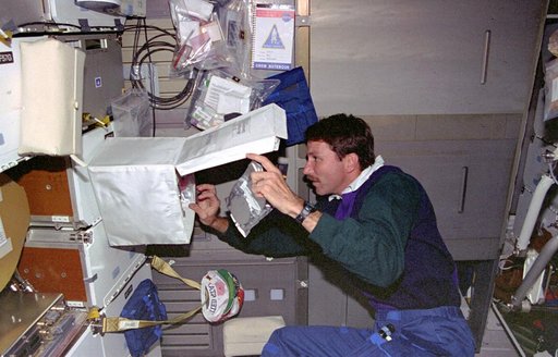 DSO 611, Pilot Kent Rominger samples air in crew compartment middeck