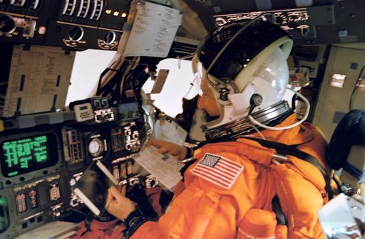 Astronaut Horowitz at shuttle controls for reentry