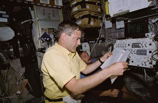 Astronaut Garneau working with Audio Control System panel