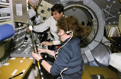 AGHF, Helms removes a sample from the LMS-1 Spacelab core facility module