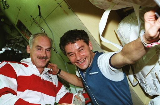 STS-79 and Mir cosmonauts in the docking module prior to undocking