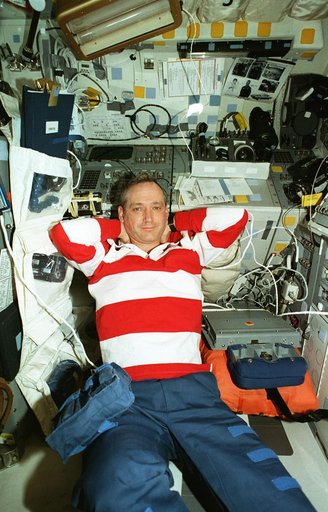 Astronauts Akers and Wilcutt relax on the Atlantis flight deck
