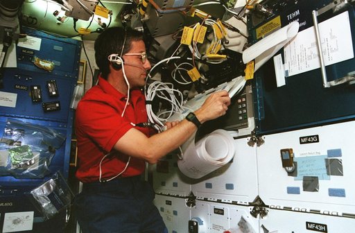 Astronaut Apt on the middeck with TIPS messages