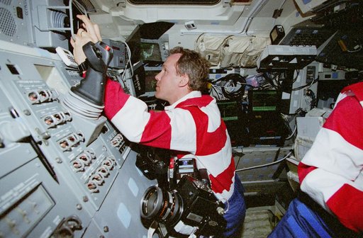 Retrieval procedures conducted in orbiter flight deck