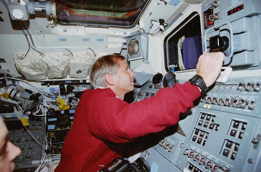 Cockrell poses at the aft flight deck station for Rendezvous and Prox-Ops