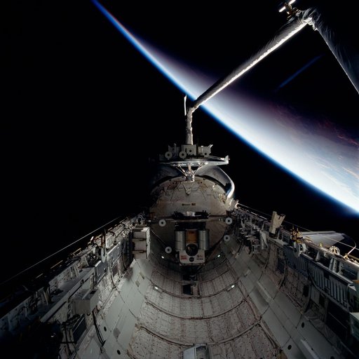 WSF, RMS arm holds satellite over payload bay