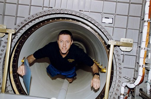 Candid views of STS-81 Cmdr Baker in Spacehab module