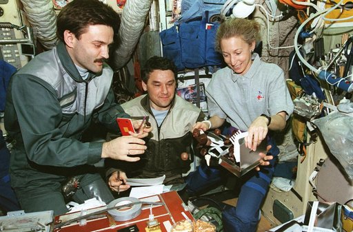 MS Ivins shares chocolates with Mir 22 crew