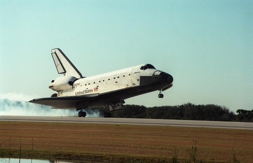 The landing of STS-81 Atlantis, OV-104, on a runway at KSC's SLF