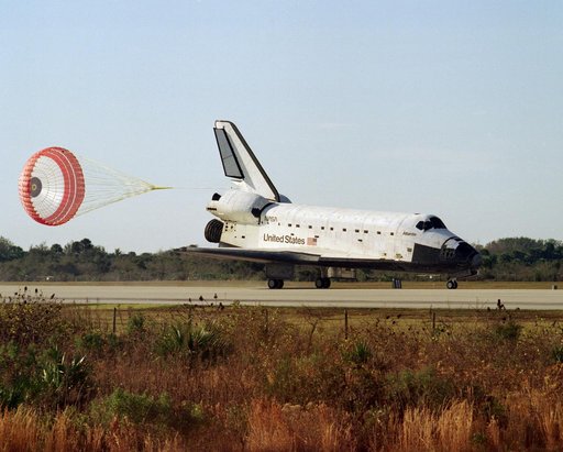 The landing of STS-81 Atlantis, OV-104, on a runway at KSC's SLF