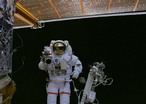 EVA 5 activity on Flight Day 7 - handheld camera views