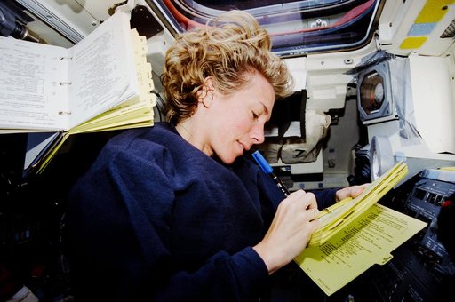 Pilot Still makes notes on aft flight deck