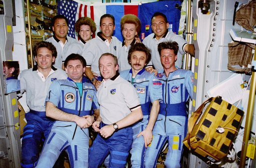 Group portrait of STS-84 and Mir 23 crewmembers in the Spacehab