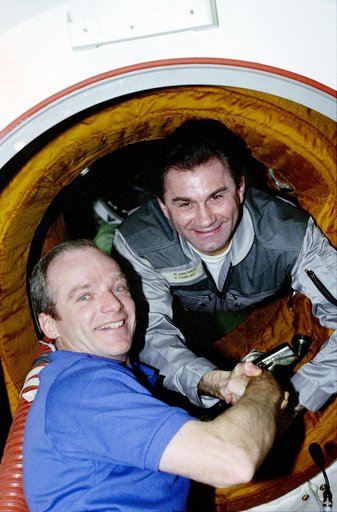 Various candid views of STS-84 crew after hatch opening