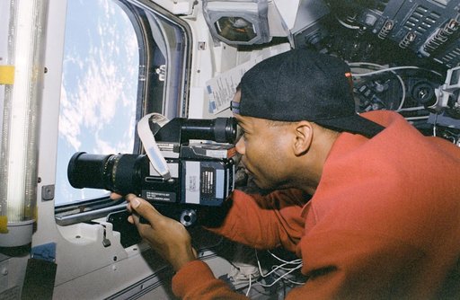 Candid views of crew activity in the flight deck and middeck