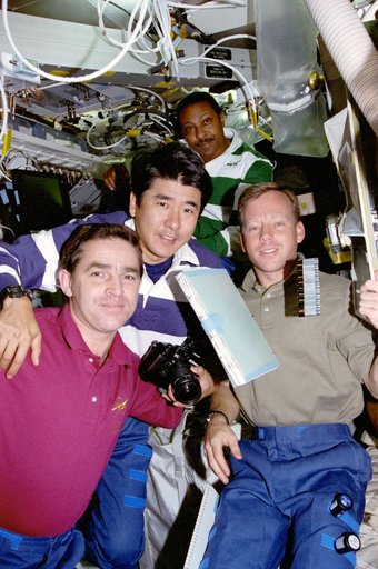 Crewmember activity in the shuttle middeck