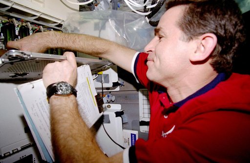 CUE - Kadenyuk checks the status of the PGCs in the middeck PGF locker