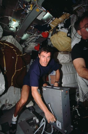 Krikalev exercises on the ergometer while on the Endeavour's middeck