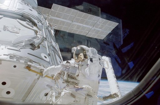 Astronaut Newman holds handrail 0133 on panel NOD1/C2-07