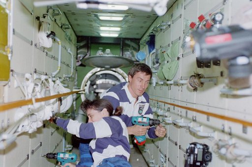 View of the STS-88 crew at work in the FGB/Zarya module