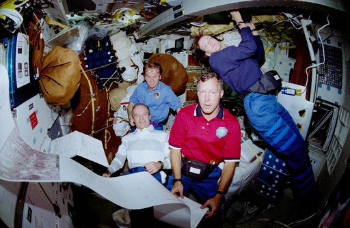 Crewmember activity in the middeck during delivery of morning mail messages