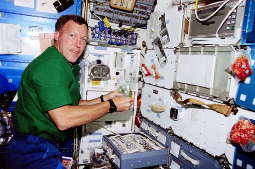 Crewmember activity in the orbiter middeck