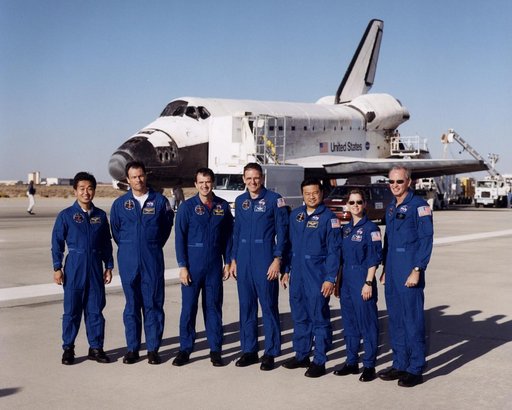 STS-92 crew poses outside shuttle after landing at Edwards