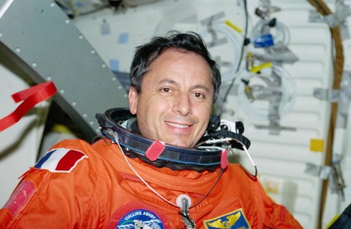 STS-93 MS Tognini poses for photos after putting on his LES on the middeck