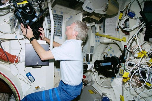 STS-93 MS Hawley works with data associated with the OCA on the middeck