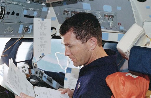 Rick Husband at his station on the forward flight deck
