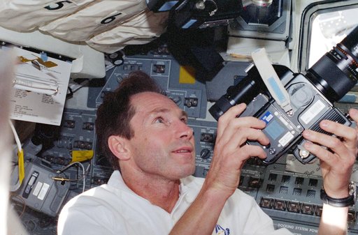 Valeri Tokarev on aft flight deck with camera