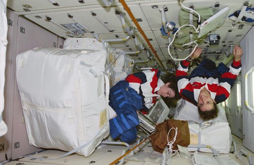 Ellen Ochoa and Julie Payette transfer stowage into FGB/Zarya module