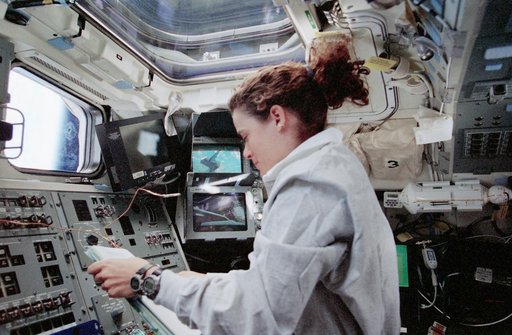 Julie Payette at RMS controls on aft flight deck