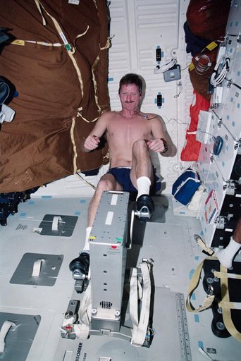 MS Tanner exercises on a cycle ergometer during STS-97