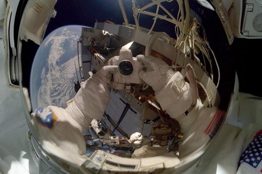 MS Tanner takes a picture of himself in his visor during an EVA of STS-97