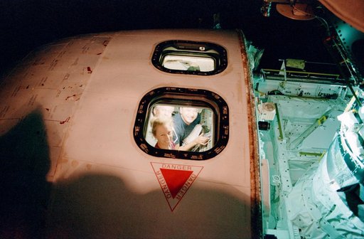 CDR Cockrell, PLT Polansky, and MS Ivins peer through AFD overhead windows