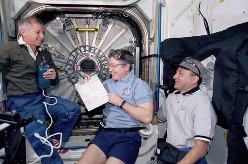 STS-98 and Expedition One crew prepare to open U.S. Lab hatch