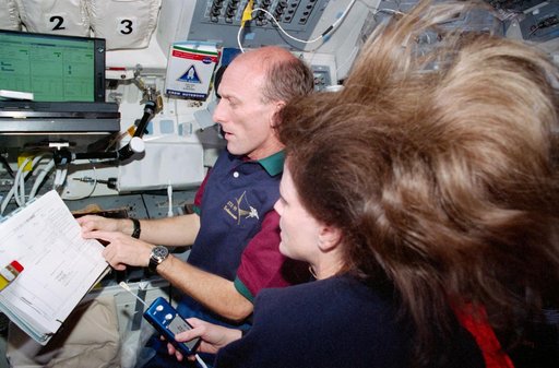 STS-99 MS Thiele and MS Kavandi work on OV-105's flight deck