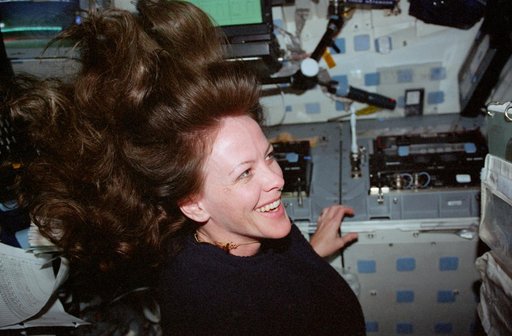 STS-99 MS Kavandi works on OV-105's flight deck
