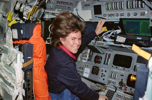 STS-99 MS Voss works at the commander's workstation on OV-105's flight deck