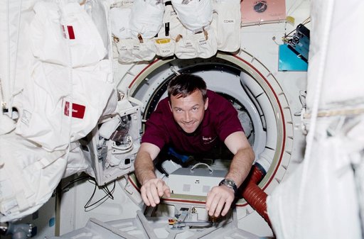 MS Lonchakov drifts through the airlock of Endeavour during STS-100