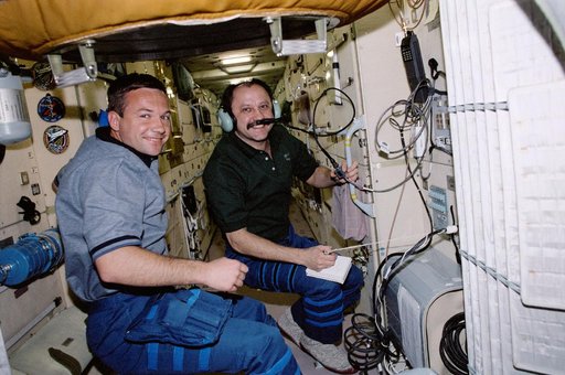 Usachev and Lonchakov use the HAM radio in Zarya during STS-100