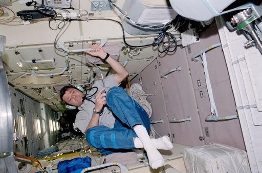 Pilot Ashby uses the HAM radio in Zarya during STS-100