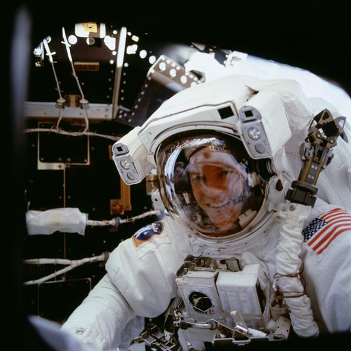 MS Parazynski looks in on his fellow crewmembers during the first EVA of STS-100